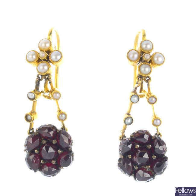 A pair of foil-backed garnet and seed pearl earrings.