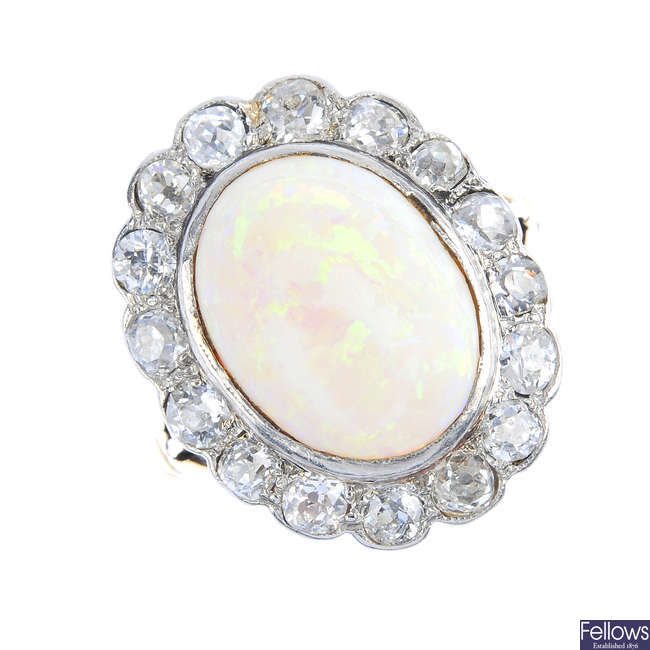 An early 20th century silver and gold, opal and diamond cluster ring.