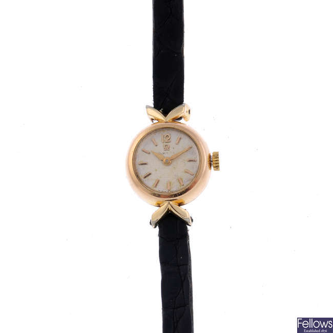 OMEGA - a lady's gold plated wrist watch.