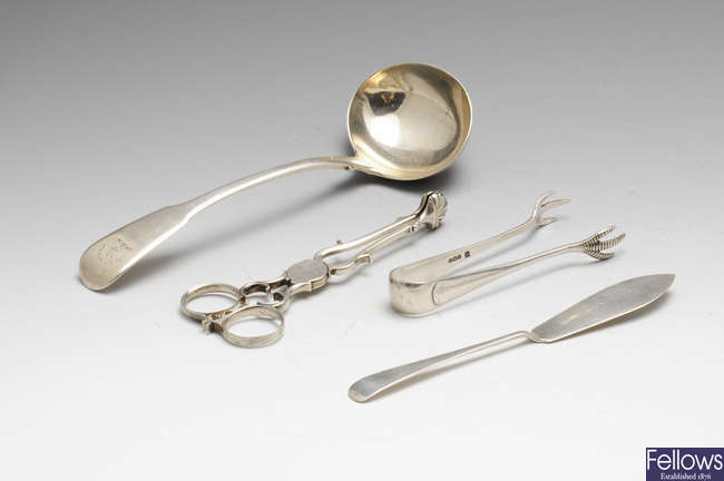 A George III silver Fiddle pattern sauce ladle, silver sugar nips, pastry forks, etc.
