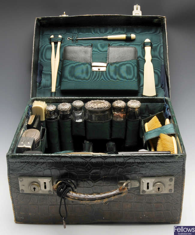 A matched and part Edwardian travelling vanity set.