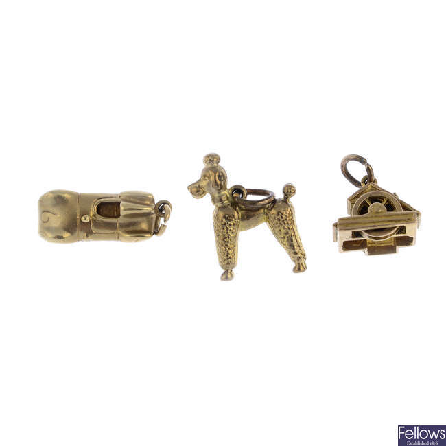 Four mid 20th century 9ct gold charms.