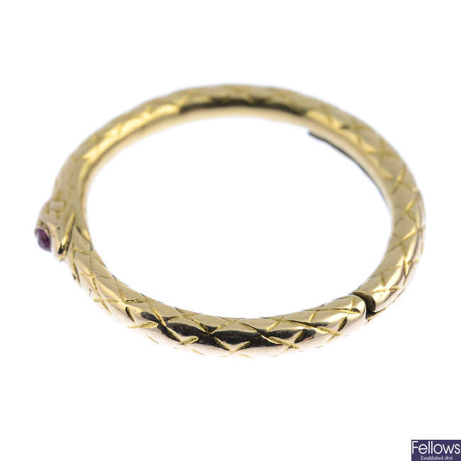A late Georgian gold ruby ouroborus split ring.