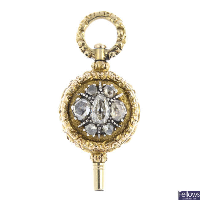 An early 19th century gold, diamond and amethyst watch key.