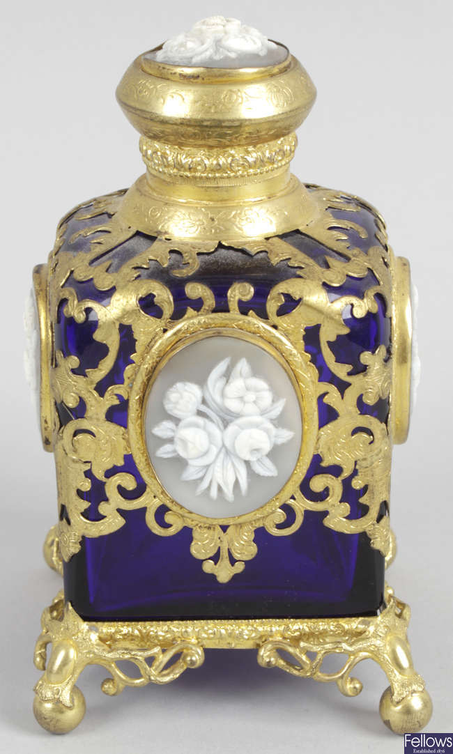 A 19th century blue glass scent bottle and stopper, together with a similar blue glass scent bottle.