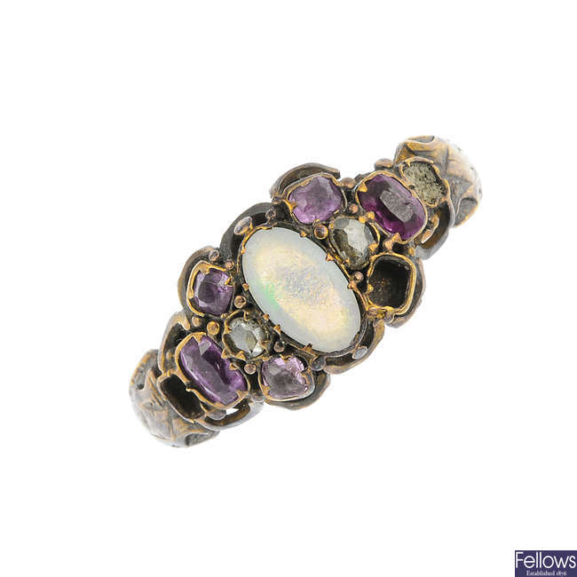 A mid Victorian 18ct gold opal, ruby and diamond ring.