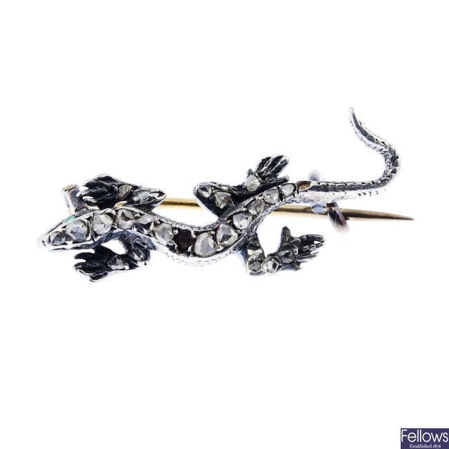 A late Victorian silver and gold diamond lizard brooch.