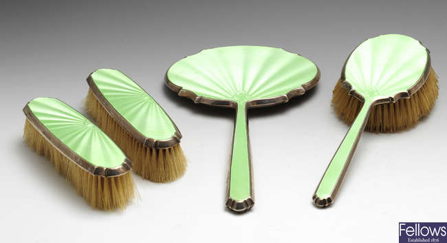 A matched 1930's four piece silver mounted dressing table set.