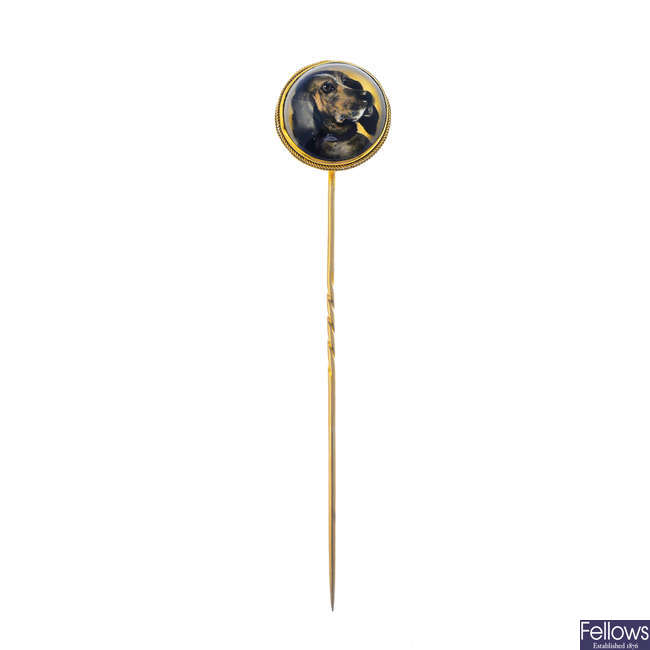 A mid Victorian gold reverse intaglio dog stick pin.