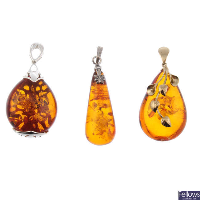 A selection of mainly modified amber jewellery in silver and white metal mounts.