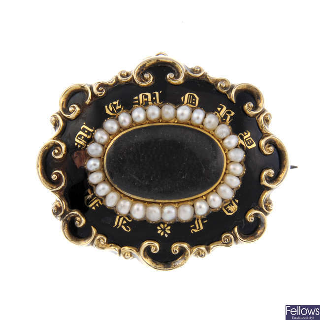 A late Victorian enamel and split pearl mourning brooch.