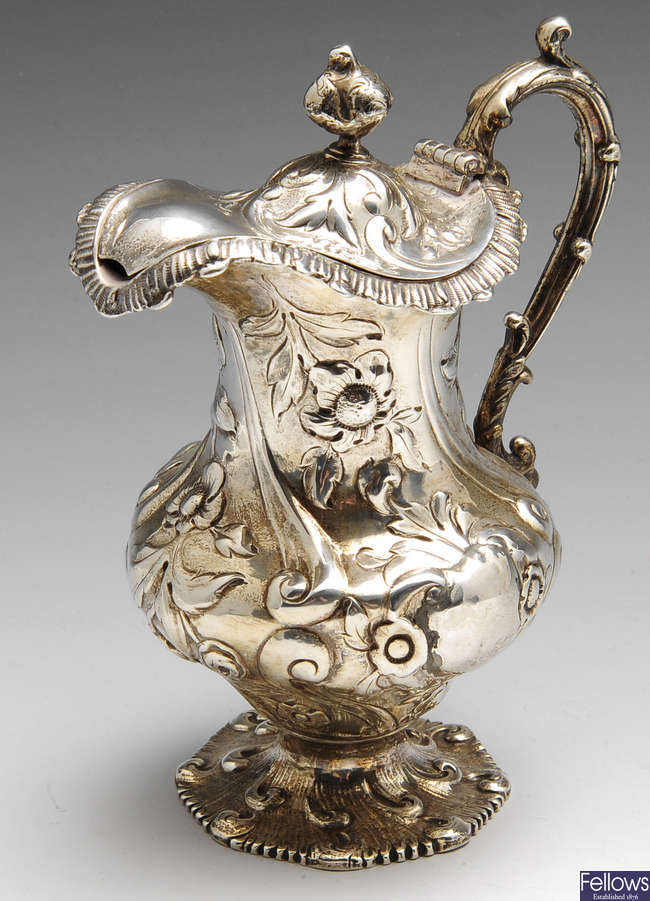 A William IV silver lidded jug.