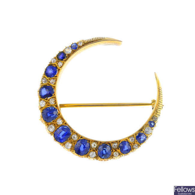 A late Victorian gold sapphire and diamond crescent brooch.