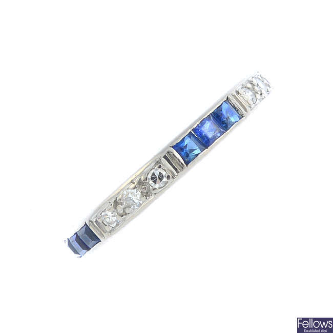 An early 20th century gold sapphire and diamond full eternity ring.