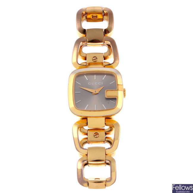 GUCCI - a lady's gold plated G-Gucci bracelet watch.