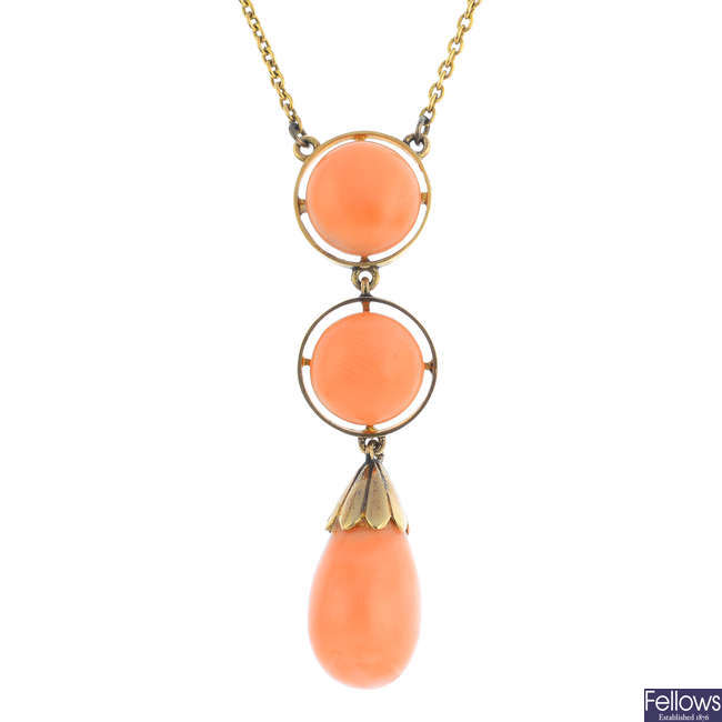 An early 20th century gold pink coral necklace.