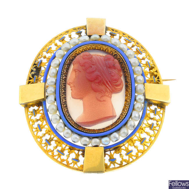 An early Victorian gold cameo brooch with enamel and seed pearls.