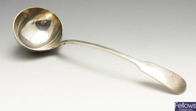 An Edwardian silver Fiddle pattern soup ladle.