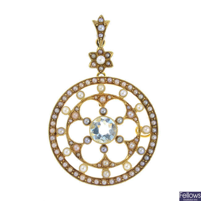 An Edwardian 15ct gold aquamarine and split pearl pendant.