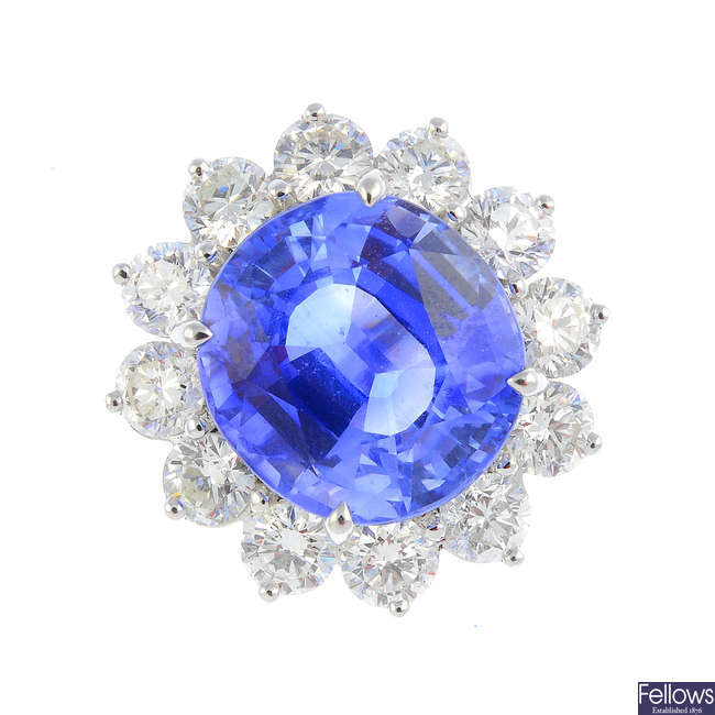 A Ceylon sapphire and diamond floral cluster ring.