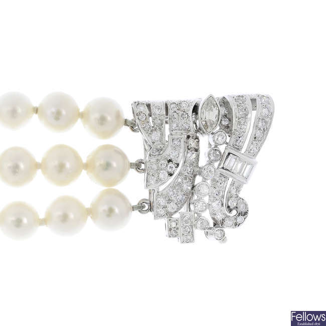 A cultured pearl three-row bracelet with diamond clasp.