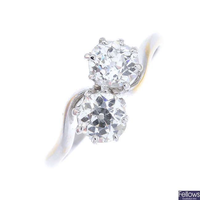 A diamond two-stone ring.