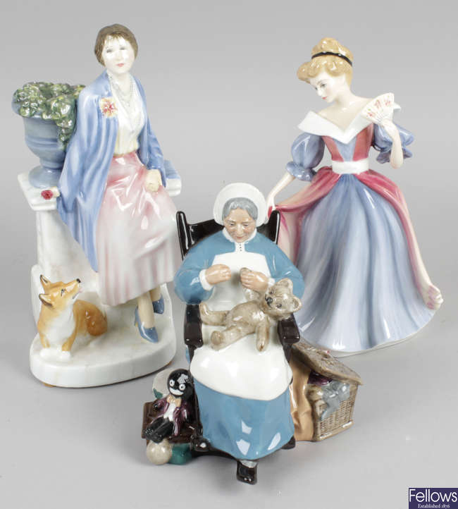 A group of twenty Royal Doulton figurines.
