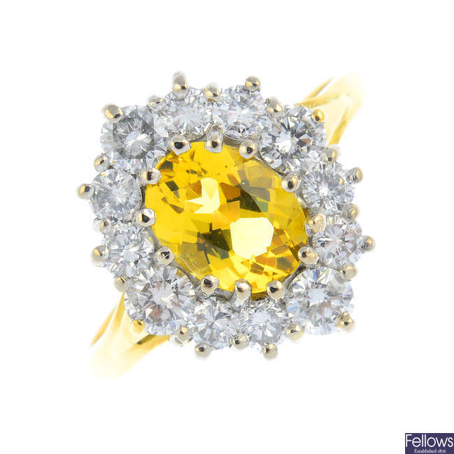 An 18ct gold heliodor and diamond cluster ring.