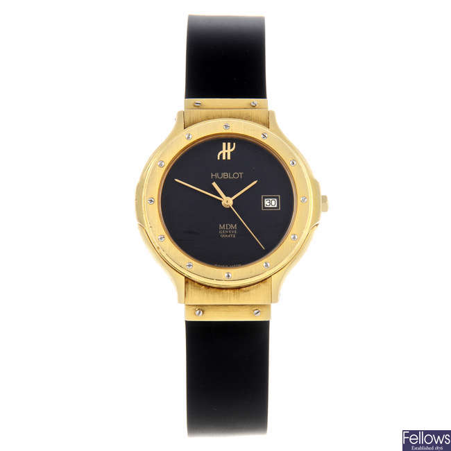 HUBLOT - a mid-size yellow metal MDM wrist watch.