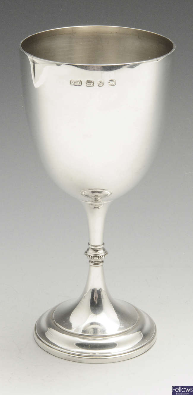 A late Victorian plain silver goblet. 