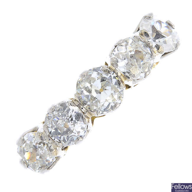 A mid 20th century gold and platinum diamond five-stone ring.