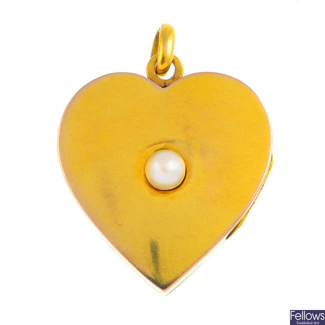 An early 20th century gold cultured pearl heart-shape locket.