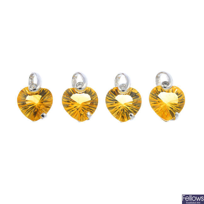 Four 18ct citrine and diamond pendants.