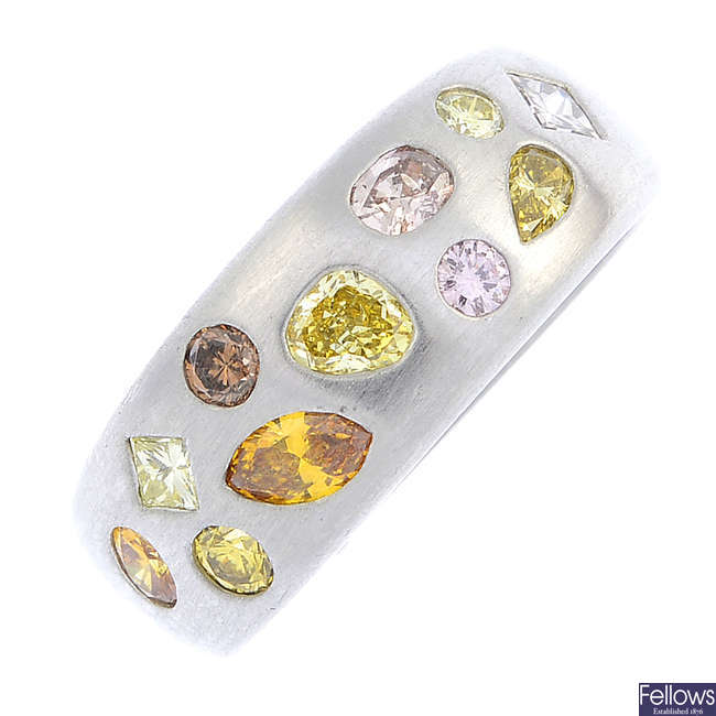 A pink, yellow and brown diamond dress ring.