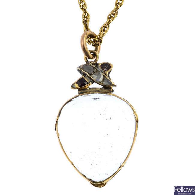 A late Georgian rock crystal, diamond and garnet locket, with chain.