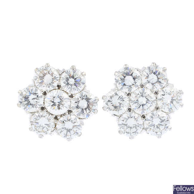 A pair of diamond floral cluster earrings.