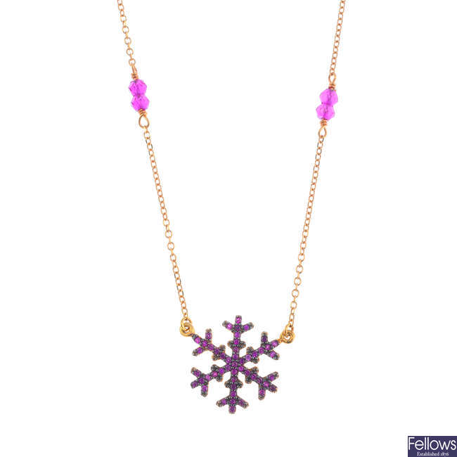 A synthetic ruby snowflake necklace.