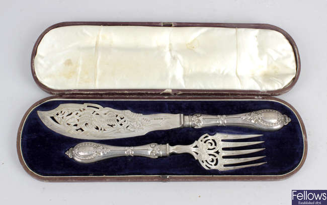 A cased pair of Victorian silver fish servers.