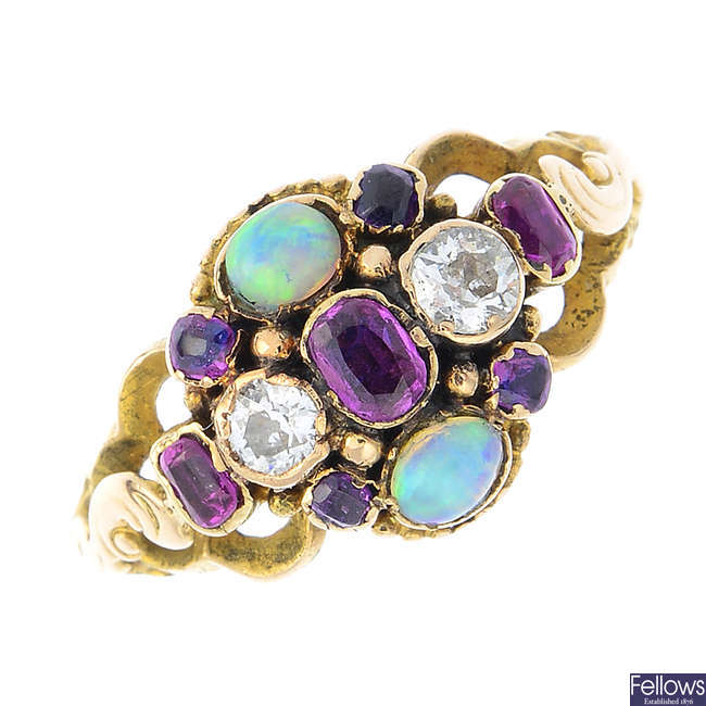 A late Victorian gold diamond, opal and ruby ring.