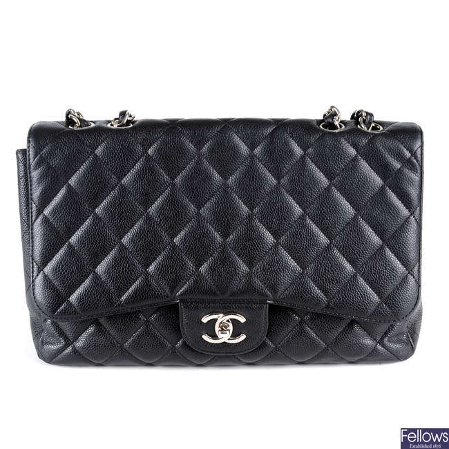 CHANEL - a Jumbo Caviar Classic Flap handbag.