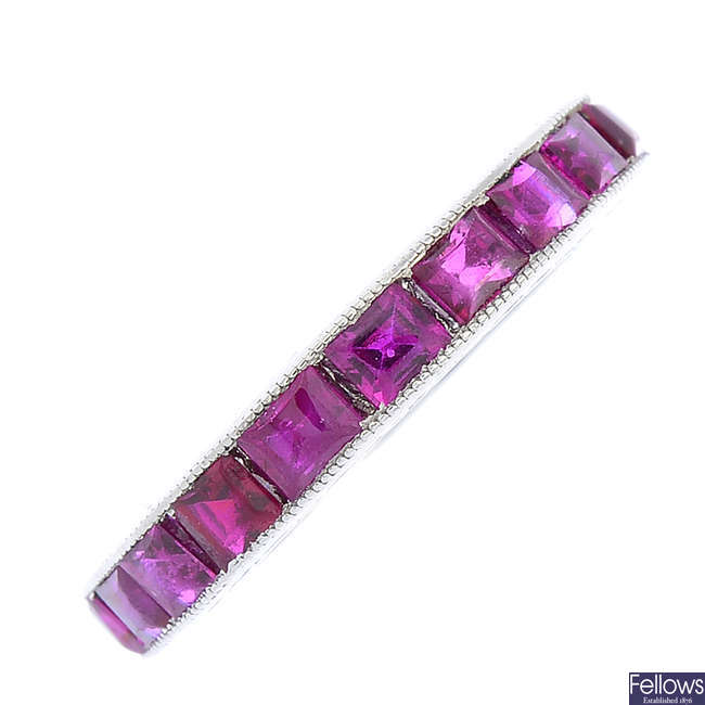 A mid 20th century platinum ruby and synthetic ruby full eternity ring.