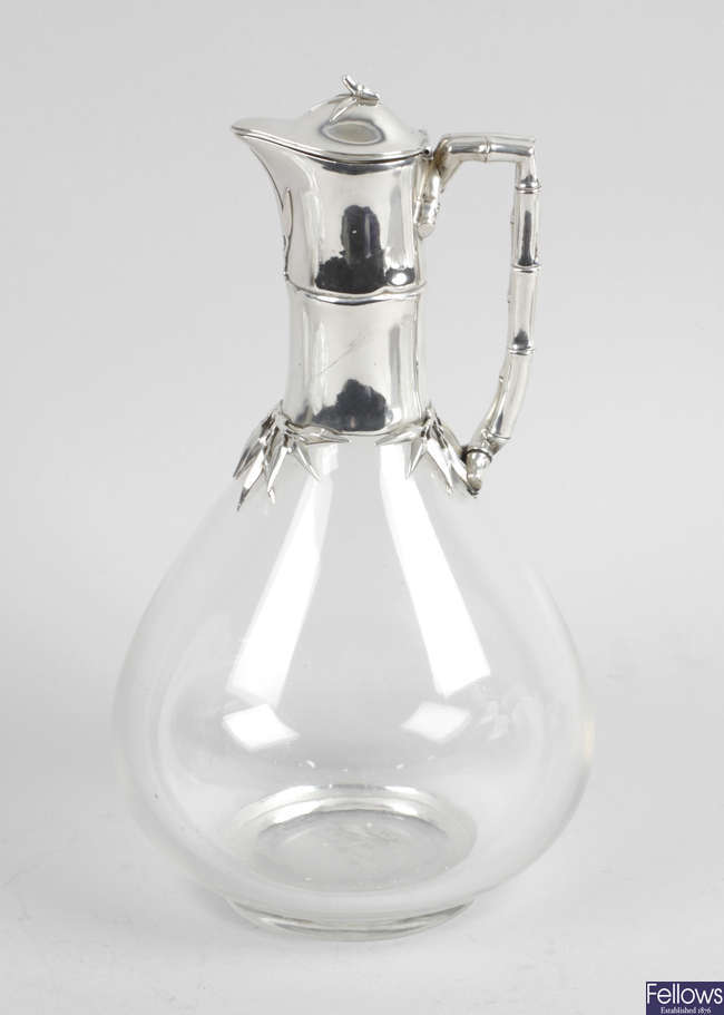 A Victorian silver mounted glass claret jug. 