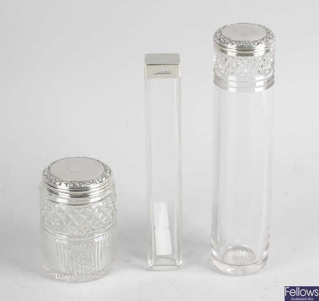 Two William IV silver lidded & glass vanity jars & a 20th century example. (3).