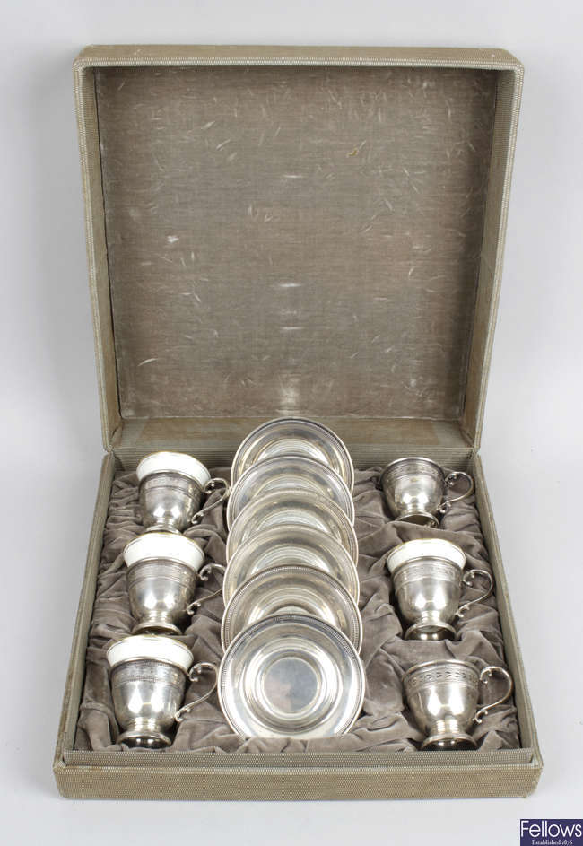 A cased set of six American sterling silver cup holders with saucers, together with Gorham coffee spoons & a pair of small vases.