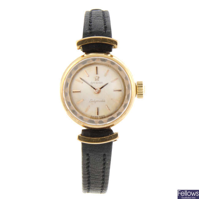 OMEGA - a lady's yellow metal Ladymatic wrist watch.