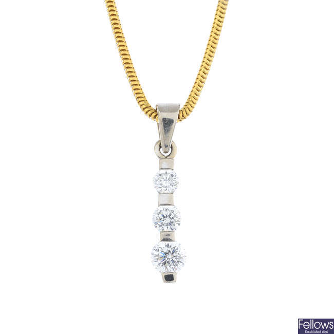 An 18ct gold diamond three-stone pendant, with an 18ct gold chain.