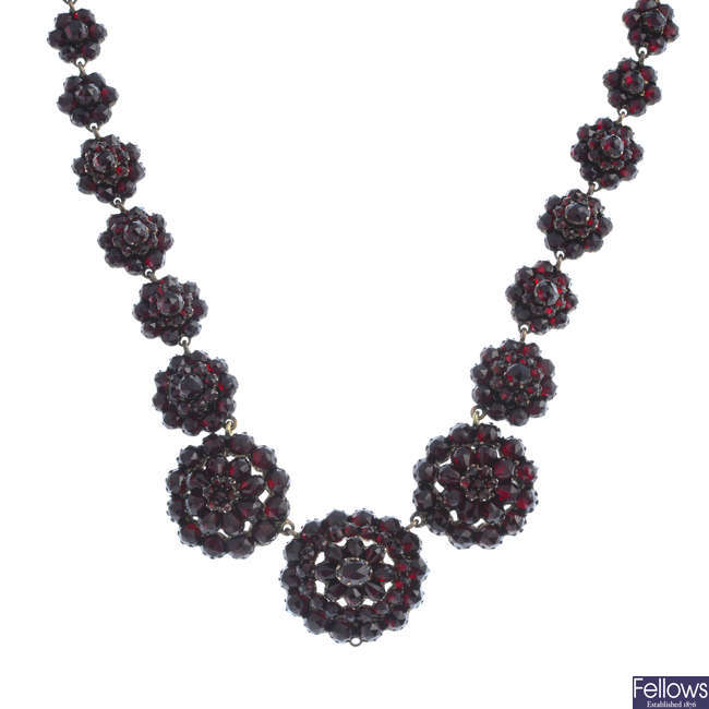 A late Victorian gold garnet necklace.