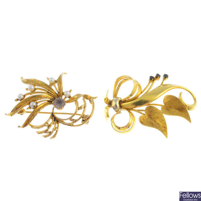 Three gold gem-set floral brooches.