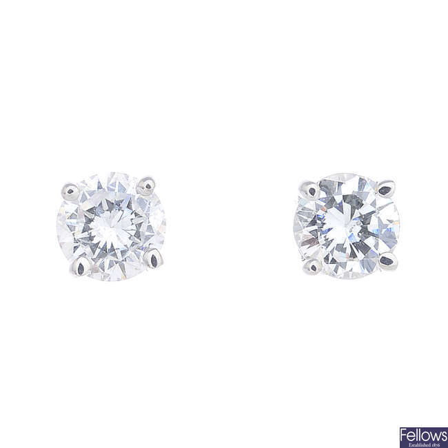 A pair of 9ct gold brilliant-cut diamond single-stone stud earrings.