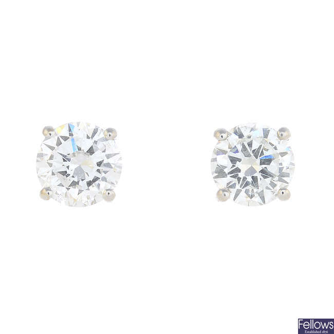 A pair of 18ct gold brilliant-cut diamond stud earrings.